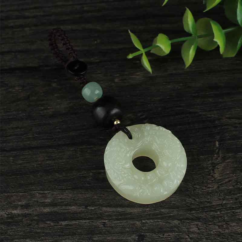 Jade PiXiu Peace Buckle Abundance Key Chain – Jade keychain hanging on black antler display stand, elegant showcase