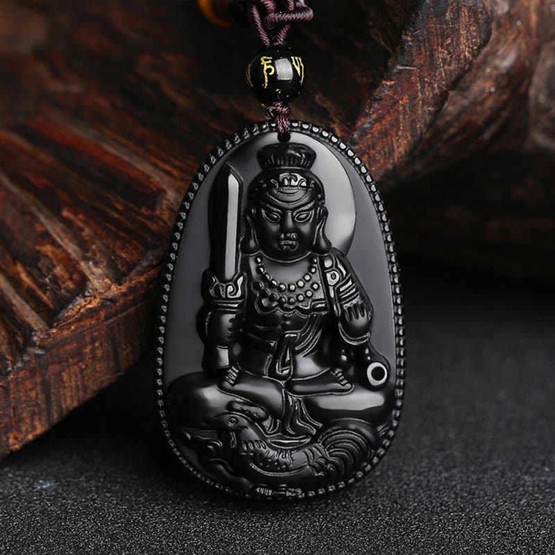 Chinese Zodiac Buddha Black Obsidian Necklace – seated guardian deity with ritual implements on teardrop obsidian, beaded border and mantra bead, zodiac amulet