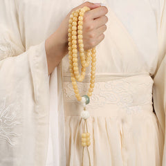 Bodhi Seed Lotus Dzi Bracelet - Mala draped over hanfu robe with embroidered clouds, meditation beads