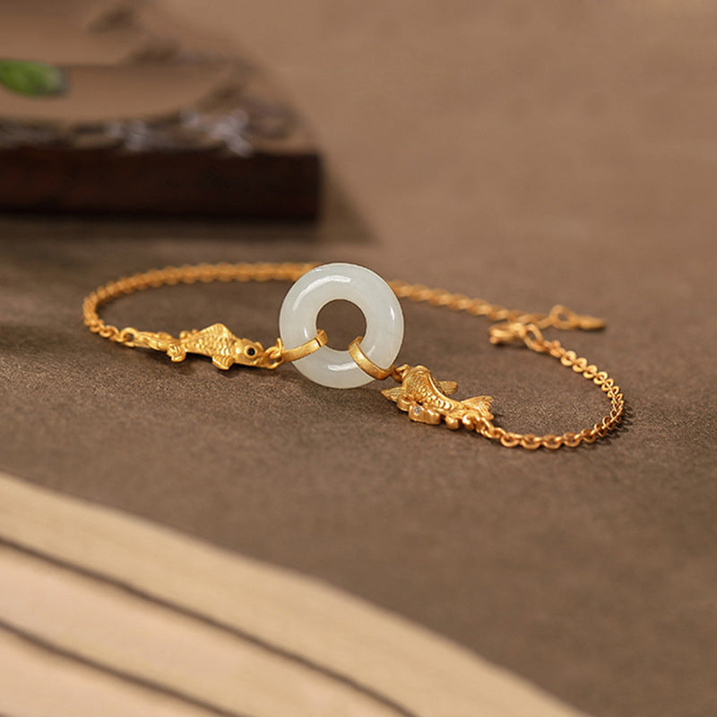 White Jade Koi Bracelet – natural light shot emphasizing milky white jade translucency
