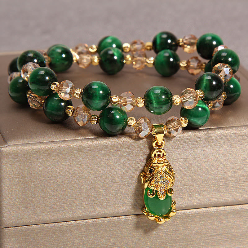 Tiger Eye Pixiu Fox Money Bag Bracelet - double-strand green tiger eye Pixiu bracelet detail shot, gold Pixiu pendant with green stone inlay, faceted champagne crystal beads, feng shui wealth jewelry