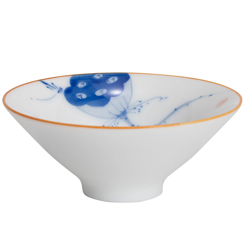 Mandala Koi Teacup – With tea poured showing golden liquid against mandala design