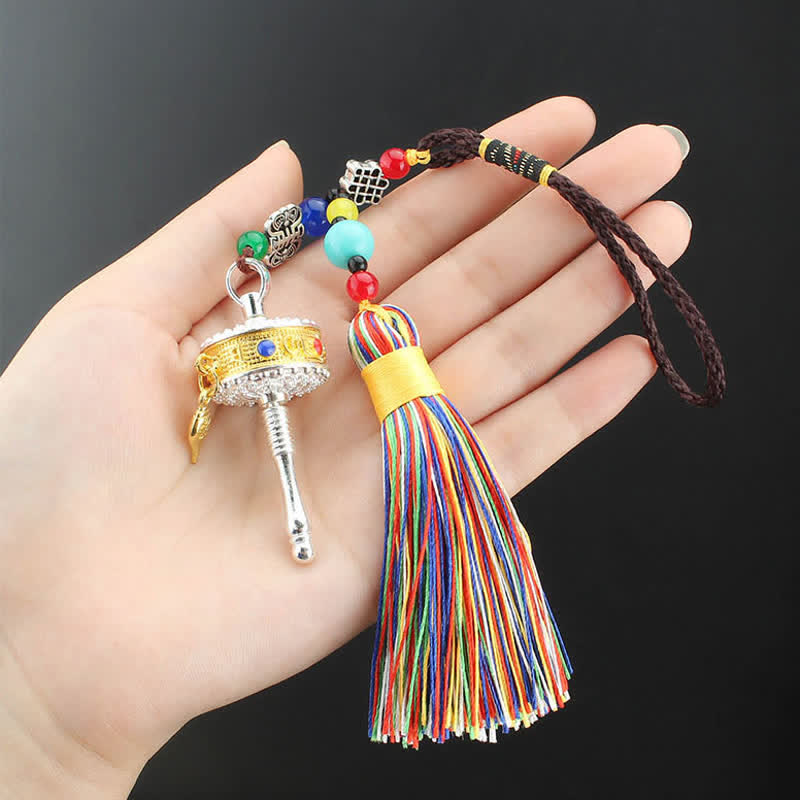 Tibetan Prayer Wheel Tassel – Mini gold silver prayer wheel with stone inlays on natural wood slice
