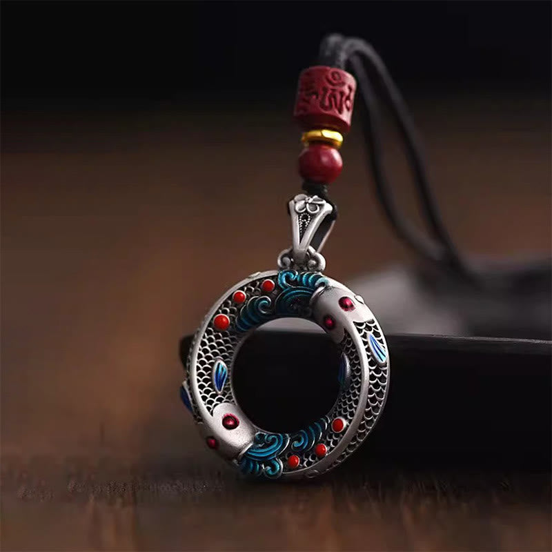 Koi Fish Copper Pendant - angled view highlighting peace buckle shape and fish details