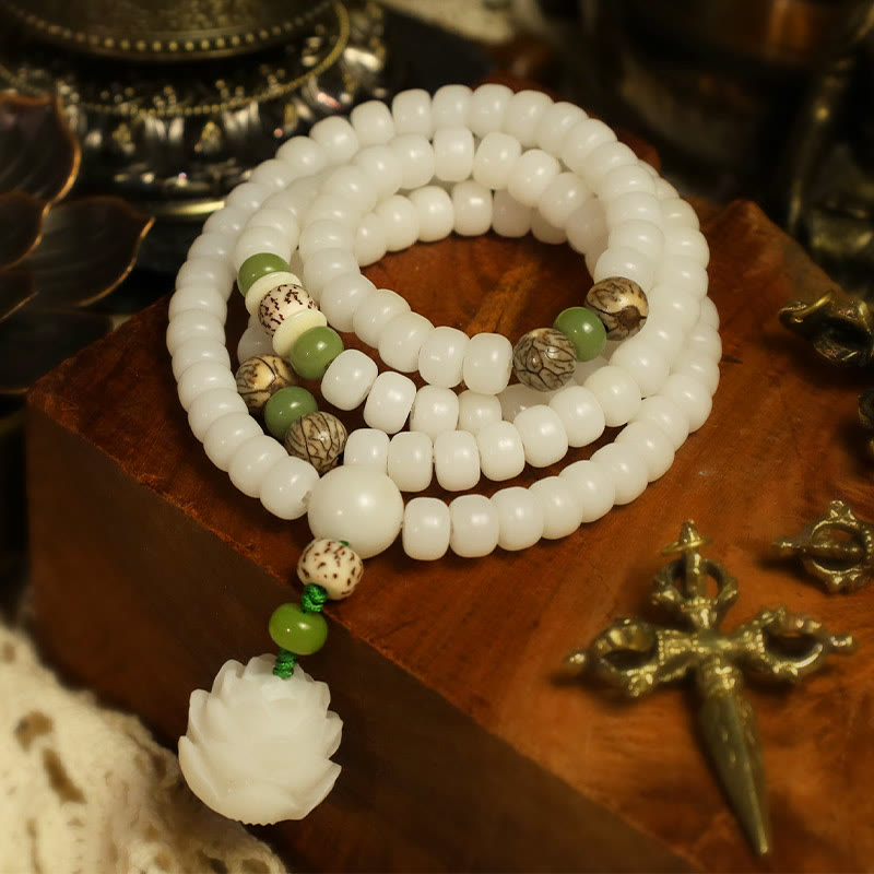 Bodhi Seed Lotus Mala - white beads with bodhi seed accents on sandalwood base, ritual context