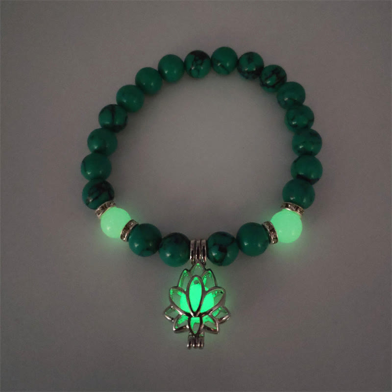 Tibetan Turquoise Glowstone Lotus Bracelet – green malachite beads with green glowing lotus charm overhead, green glowstone