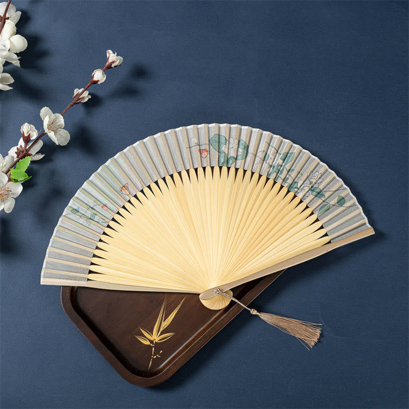 Lotus Begonia Jasmine Handheld Bamboo Folding Fan - two fans stacked, lotus jasmine with butterfly accents