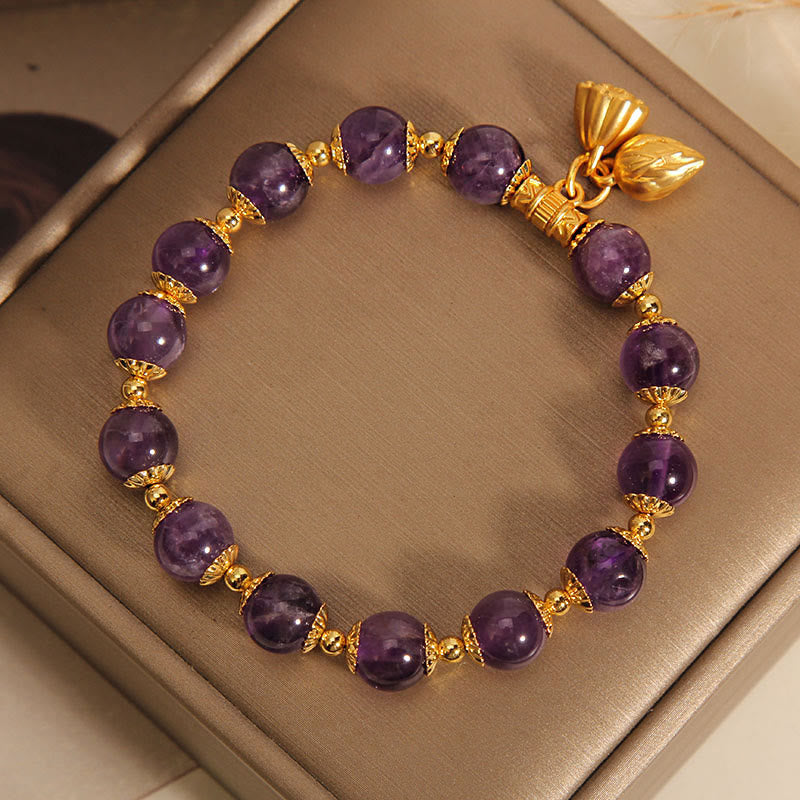Natural Amethyst Lotus Healing Bracelet - amethyst with gold lotus charms in taupe jewelry box, zen