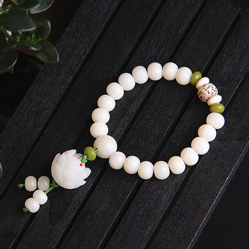 Lotus Wisdom Bracelet – Detail of polished white bodhi beads and olive green spacers, natural stone texture