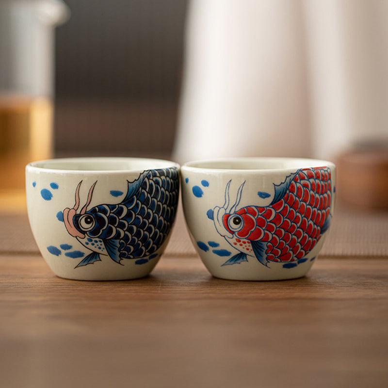 Koi Sunflower Teacup – held in hand showing 60ml capacity, kung fu teaware