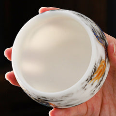 Dragon Playing Pearl Porcelain Teacup – Top-down into creamy interior with gold dragon and clouds on rim, hidden art