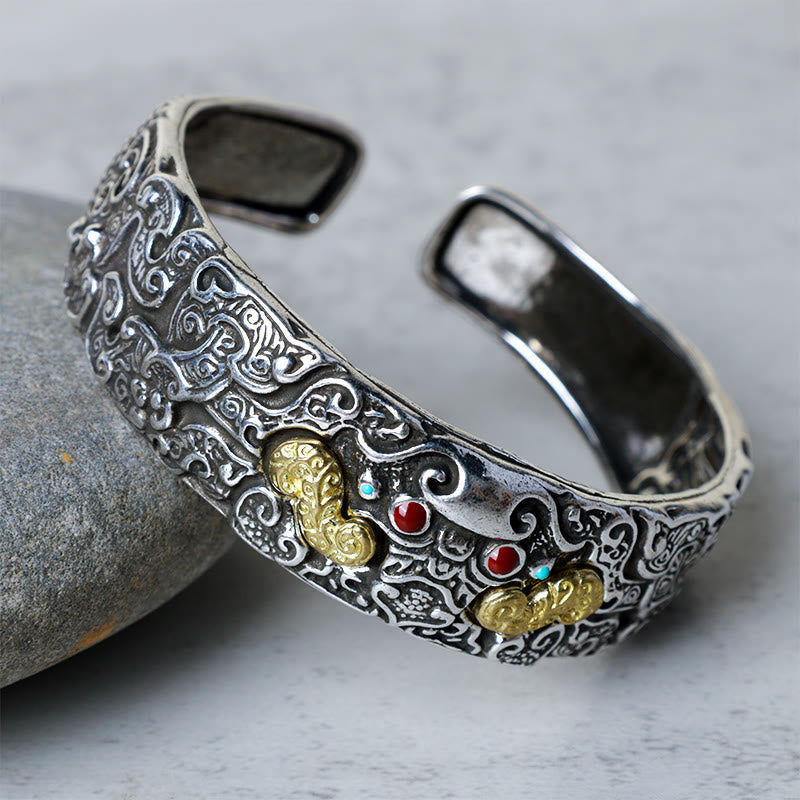 PiXiu Engraved Blessing Bracelet Bangle – silver-plated copper cuff side angle on gray stone, engraved prosperity