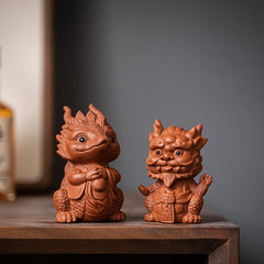 Luck Dragon Purple Clay Tea Pet - two guardian beasts on dark wood, prosperity pairing