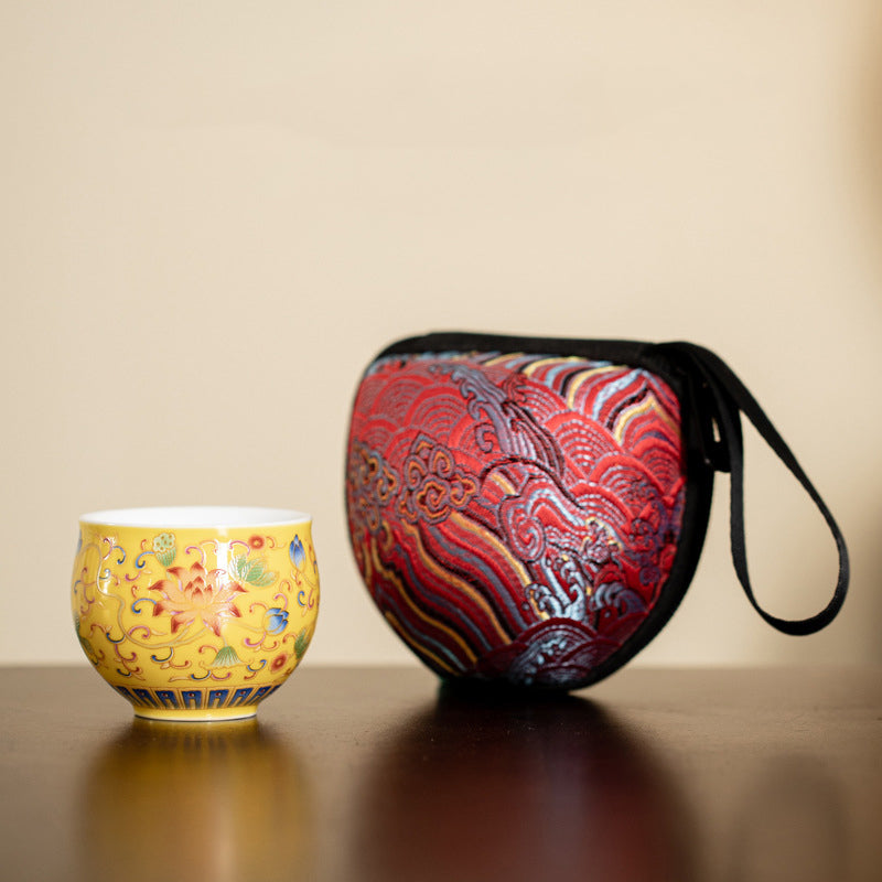 Lotus Pod Ceramic Tea Cup – yellow lotus cup beside embroidered red travel case, tea gift