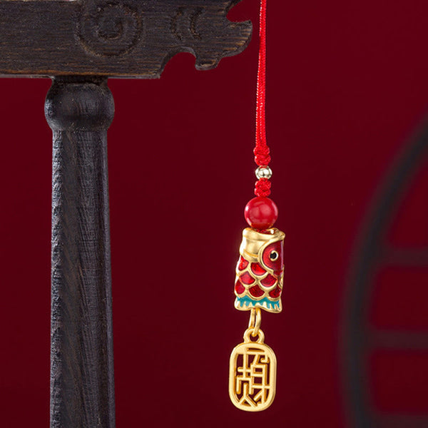 Koi Fish Cinnabar Ruyi Phone Charm – detail of cinnabar koi scales and ruyi head engraving, red phone charm tassel