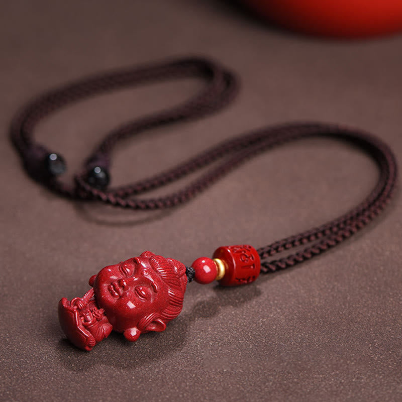 Chinese Zodiac Cinnabar Pendant – Buddha head carving with decorative beads on neutral background, natal amulet