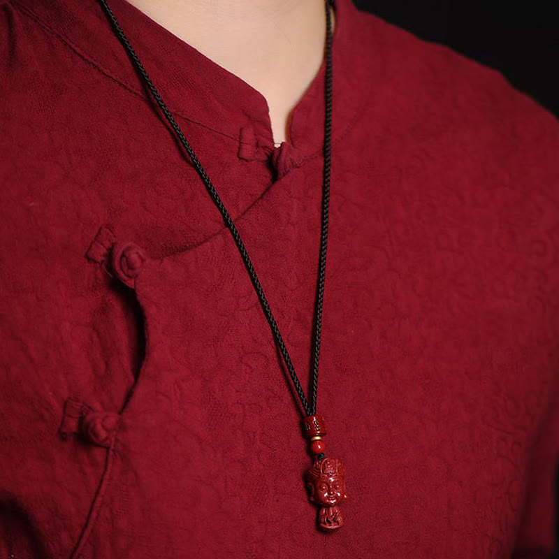 Chinese Zodiac Cinnabar Pendant – Styled on black cord with red mandarin collar outfit, ethnic necklace