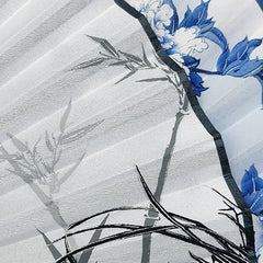 Vintage Silk Folding Fan - Black silk tassel and lacquered bamboo rib detail on gray fabric, handcrafted fan