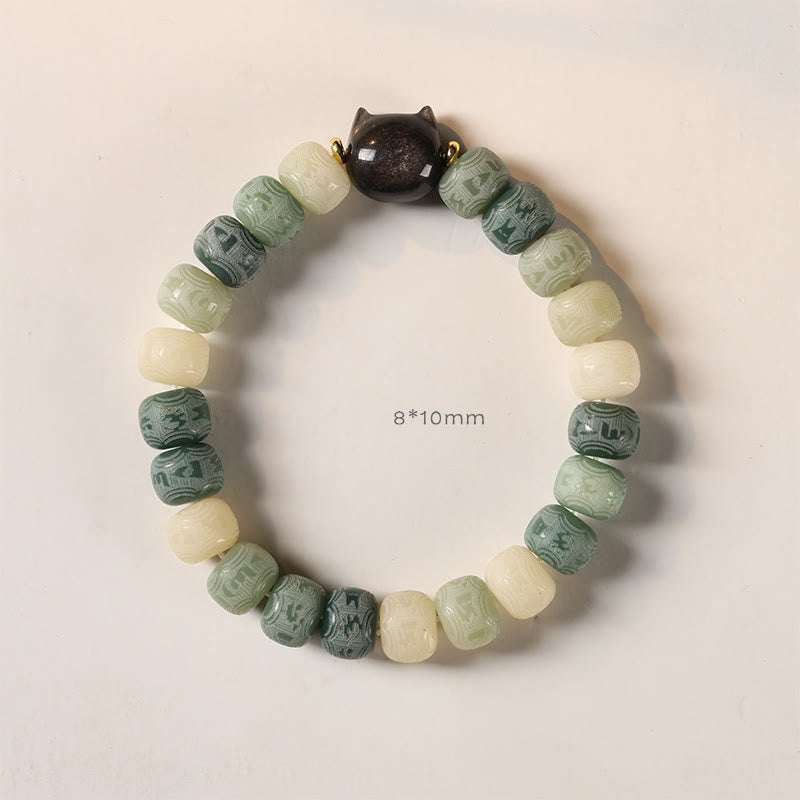 Bodhi Seed Cat Head Bracelet – Sage green ombre beads with obsidian cat head on off-white background, 8x10mm carved bead bracelet