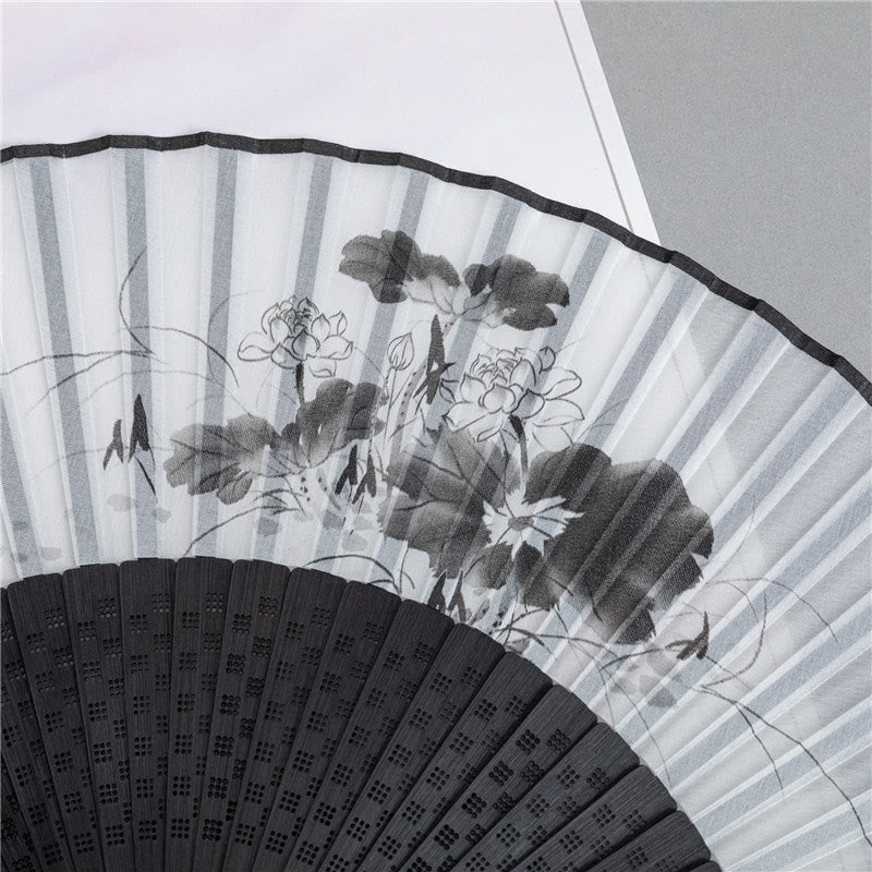 Bamboo Ink Wash Fan – Close-up of black fan ribs with bamboo painting and lattice cutouts, hand fan