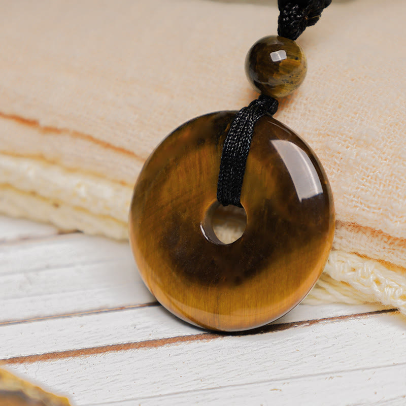 Lucky Coin Pendant Healing Crystal Gemstone Necklace – Honey-brown tiger's eye pi disc with golden chatoyancy on braided black cord