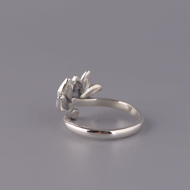 925 Sterling Silver Lotus Ring - Polished silver flower on smooth band, three-quarter view, silver jewelry