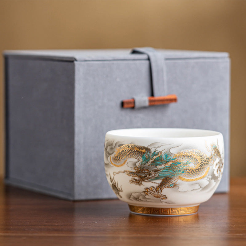 Dragon Phoenix Clouds Ceramic Teacup Gift Set – Orange-red dragon cup in hands, second bird motif cup, sharing