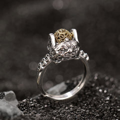 Sterling Silver PiXiu Wealth Ring – Silver ring with gold pixiu beast and coin orb on dark stone, feng shui