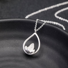 Sterling Silver Lotus Pendant – On curved ceramic dish, sculpted bloom, Artisan crafted