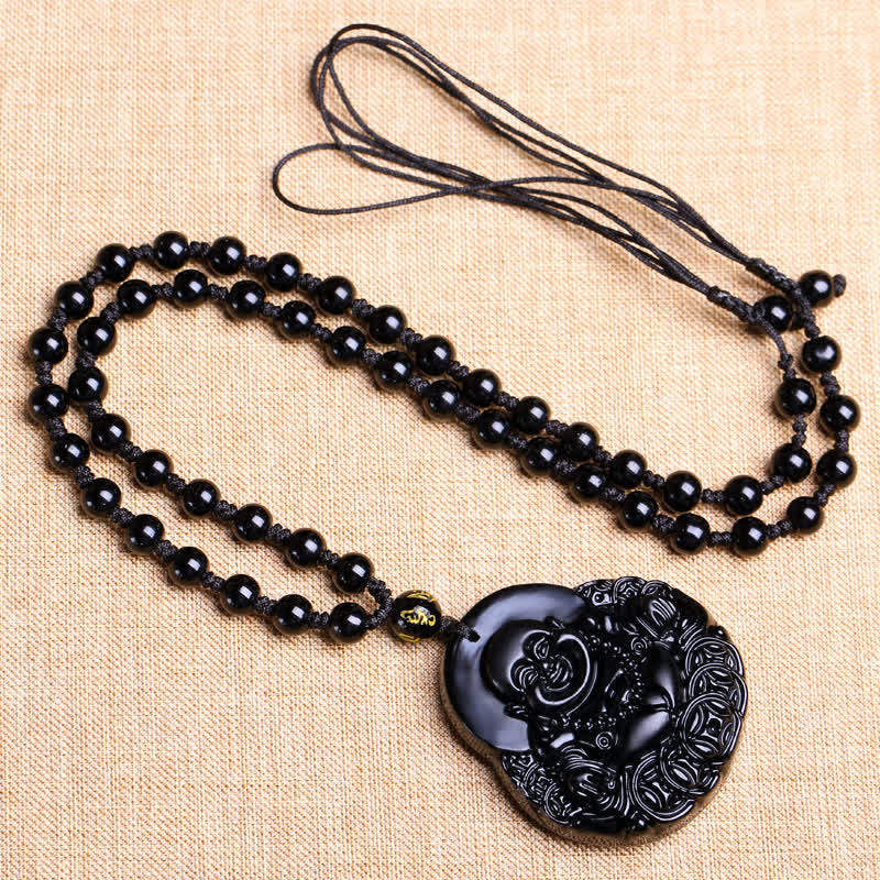 Black Obsidian Laughing Buddha Pendant Necklace – full black bead necklace flatlay with Buddha pendant – flatlay, detail