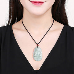 Zodiac Buddha Jade Necklace – woman wearing pale green jade guardian pendant with red bead, black cord, elegant style