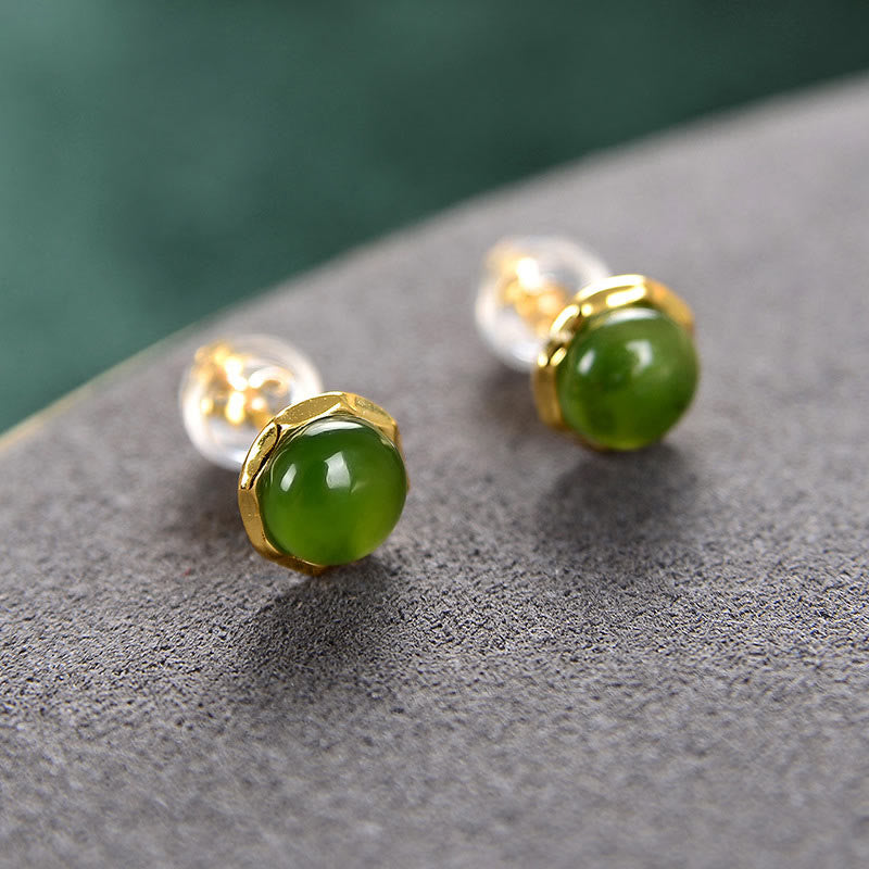 Hetian Cyan Jade Gold Plated Silver Stud Earrings with ear backs on gray stone