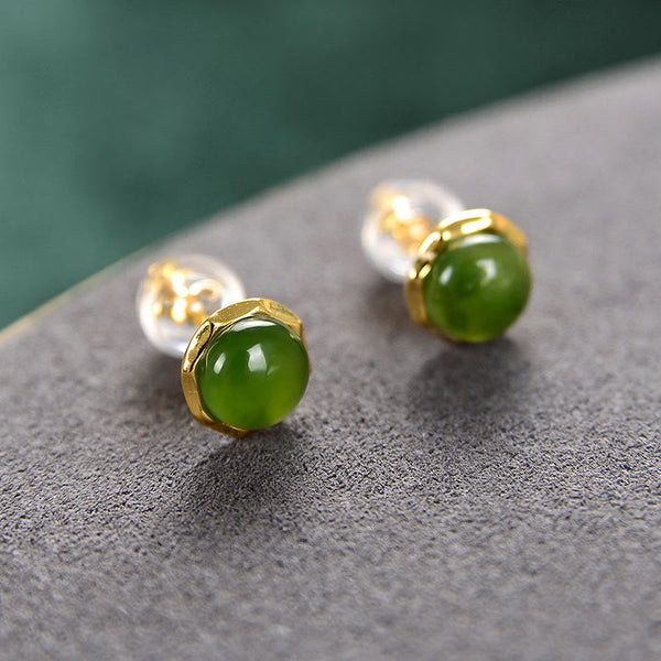 Hetian Cyan Jade Gold Plated Silver Stud Earrings with ear backs on gray stone