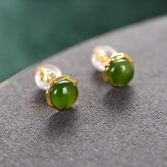 Hetian Cyan Jade Gold Plated Silver Stud Earrings with ear backs on gray stone