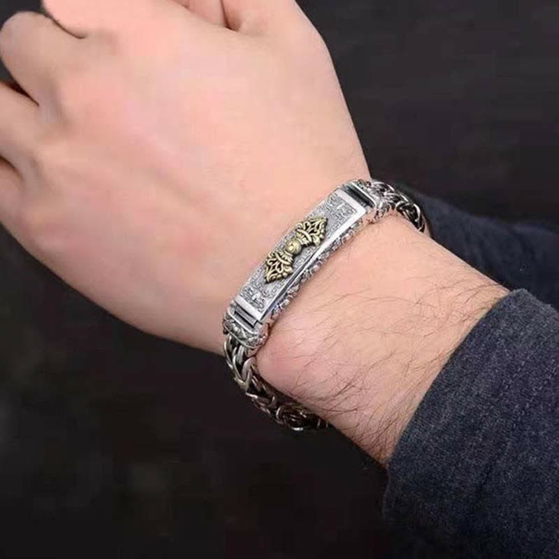 Vajra Dorje Copper Balance Bracelet - twisted braided copper chain bracelet with gold-tone vajra dorje centerpiece, worn on wrist, two-tone silver and gold finish, oxidized metal, lifestyle shot