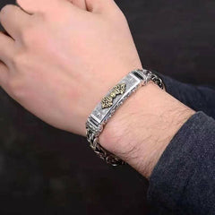 Vajra Dorje Copper Balance Bracelet - twisted braided copper chain bracelet with gold-tone vajra dorje centerpiece, worn on wrist, two-tone silver and gold finish, oxidized metal, lifestyle shot