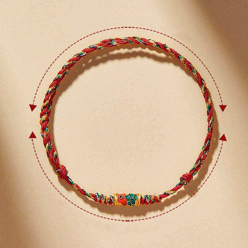 Koi Fish Wealth Bracelet – Detailed koi fish wealth symbol on red braided cord, protection