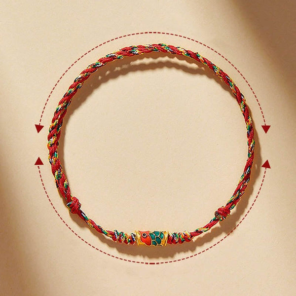 Koi Fish Wealth Bracelet – Detailed koi fish wealth symbol on red braided cord, protection