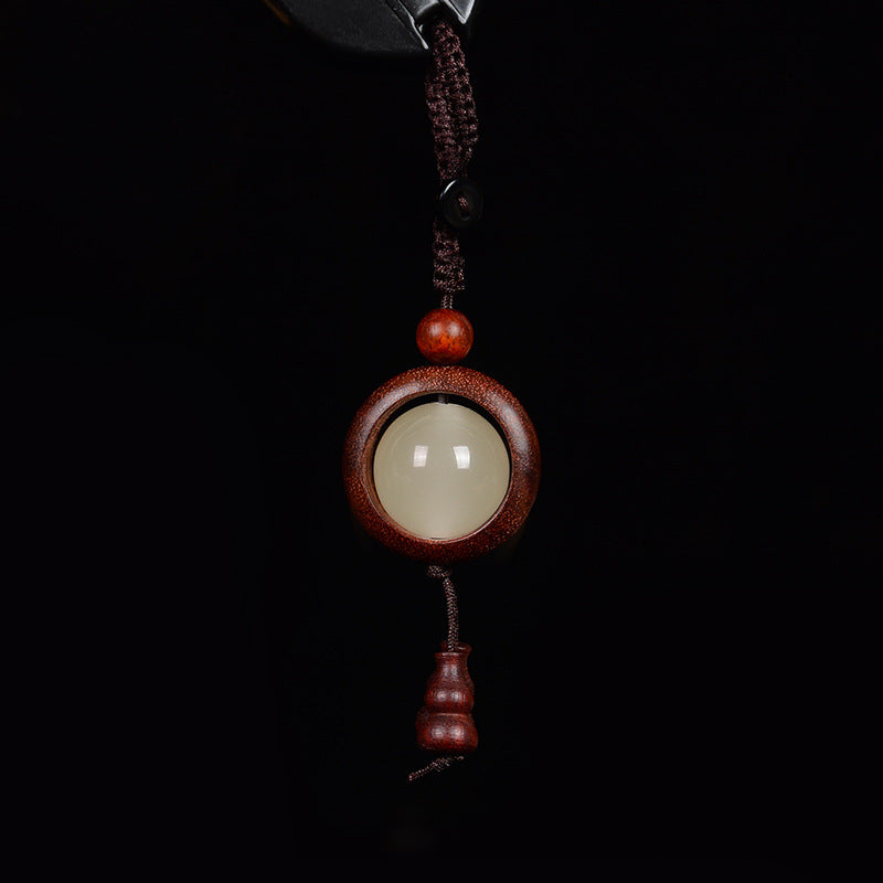 Feng Shui Sandalwood Keychain with Luminous Bead – Bloodwood red-brown version with glowing center and matching gourd pendant
