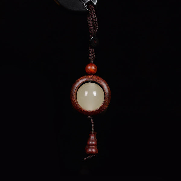 Feng Shui Sandalwood Keychain with Luminous Bead – Bloodwood red-brown version with glowing center and matching gourd pendant