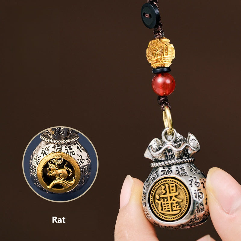 Gira la fortuna: 12 llaveros del zodiaco con bolsas de riqueza giratorias