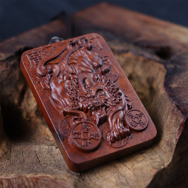 Lightning Struck Jujube Wood PiXiu – Angled view of carved jujube wood PiXiu pendant