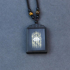 Ebony Wood Lotus Pendant – Overhead flat lay with sacred flame design, Meditative