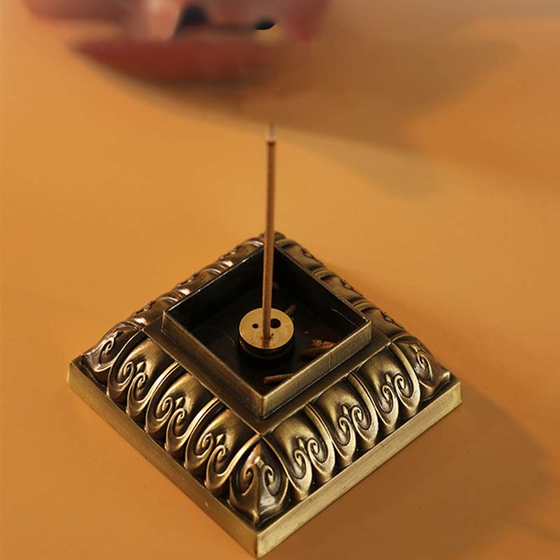 Heart Sutra Incense Burner – tiered base with lit incense stick, ritual