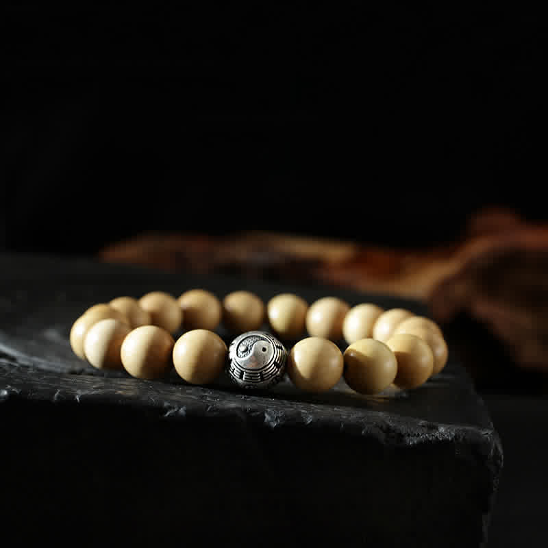 Peach Wood Cinnabar Bracelet – Yin yang engraved bead with concentric rings on wood beads, feng shui