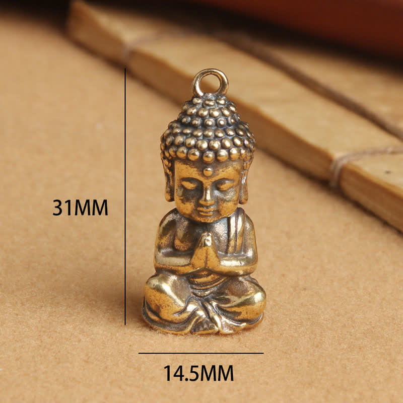 Buddha Compassion Charm – handheld size comparison, copper keychain