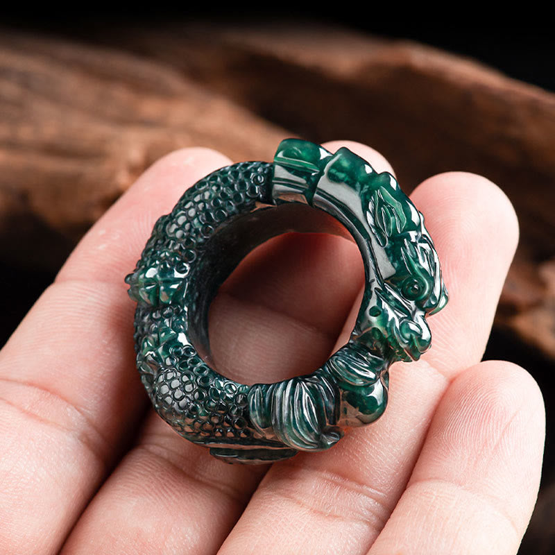 Natural Cyan Jade Dragon Ring held in hand, thumb ring scale, carved scales close-up, success talisman
