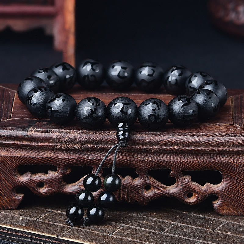Om Mani Padme Hum Bracelet - Polished black onyx beads with silver mantra carvings and tassel, onyx mala