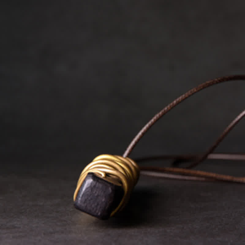 Ebony Wood Pendant Necklace – Raw stone in gold wire cage on cord, artisan zen amulet