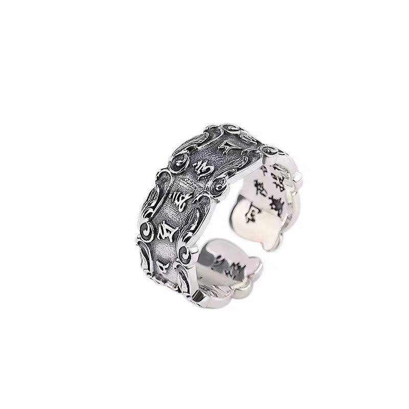 Tibetan Om Mani Padme Hum Ring – White background studio shot showing outer Sanskrit engraving and inner band, adjustable ring